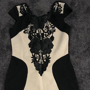 Beige dress with black lace detail